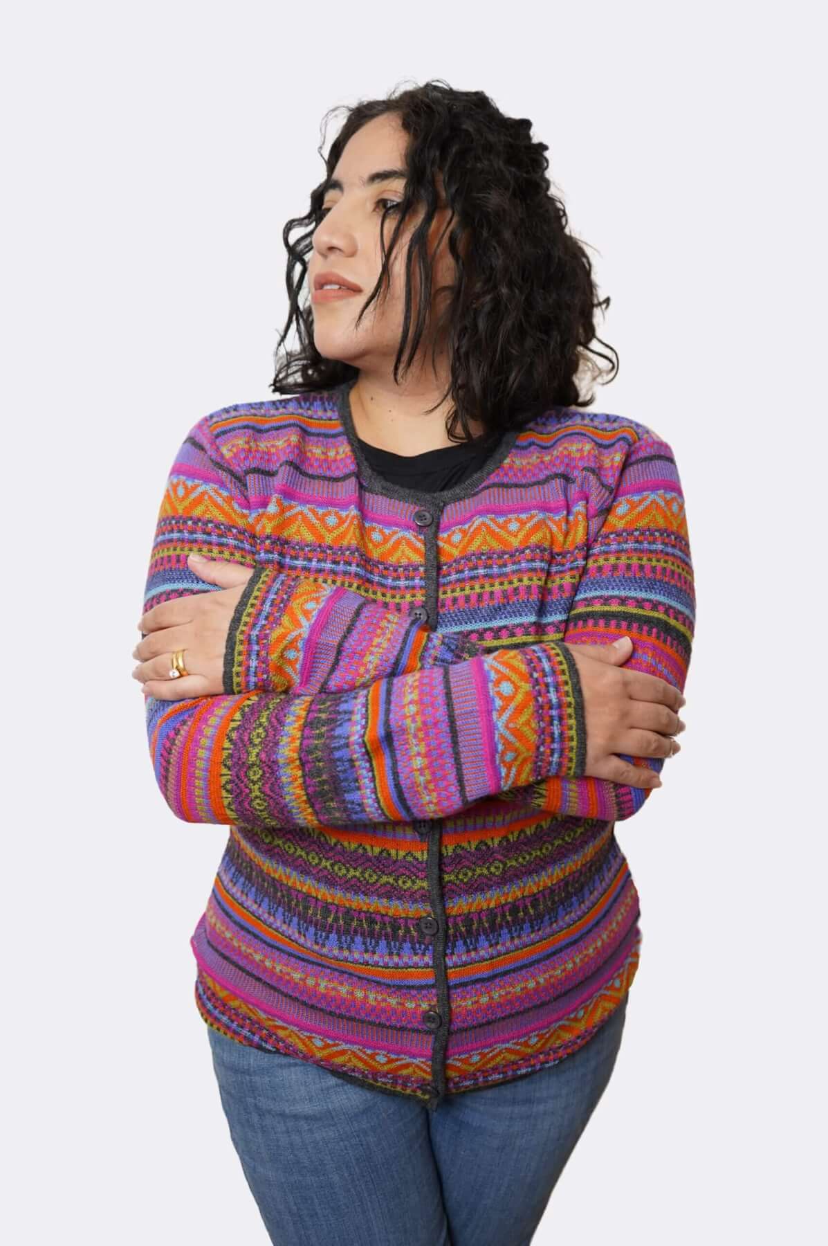 Woman wearing striped alpaca cardigan - arms crossed buttoned