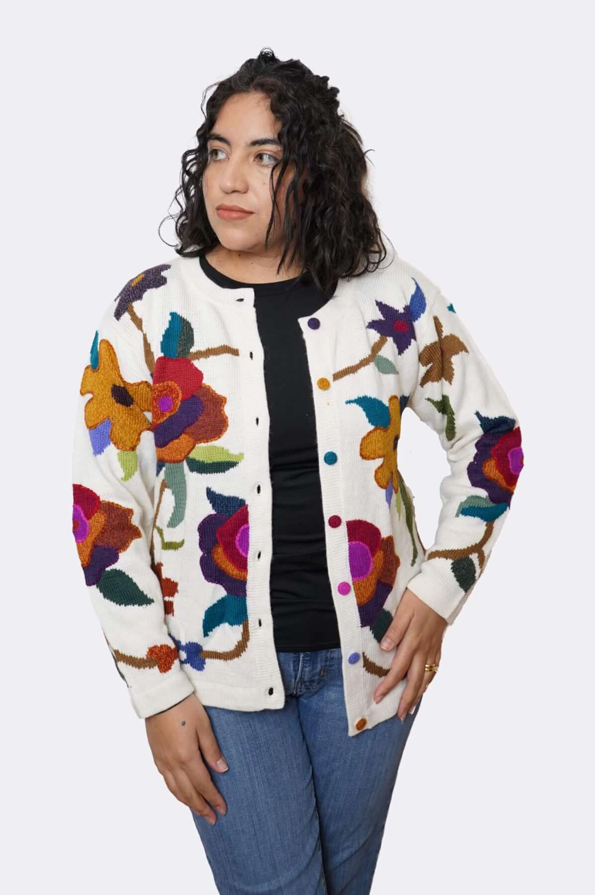 Woman modeling baby alpaca floral sweater - hands on hips